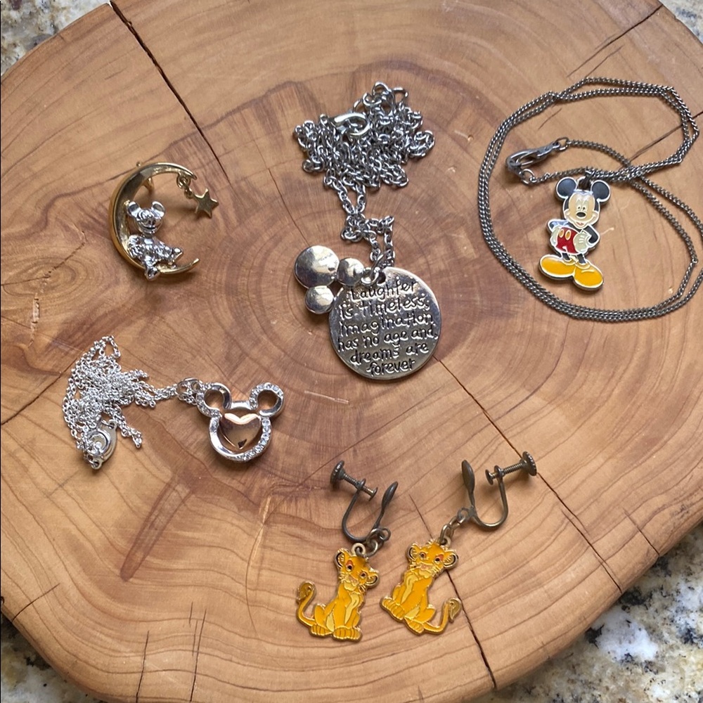 Disney pendants (4) and The Lion King earrings.
